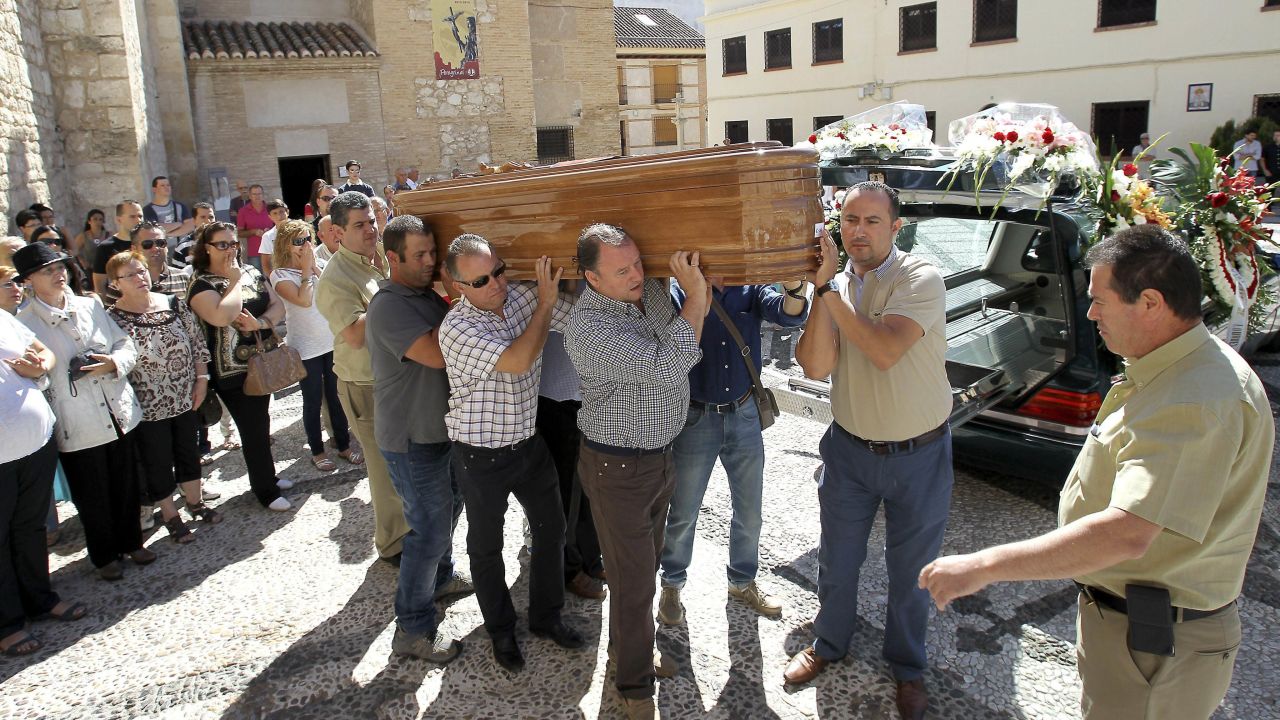 People carry the coffin of a victim in Ciudad Real, Spain, on July 29.