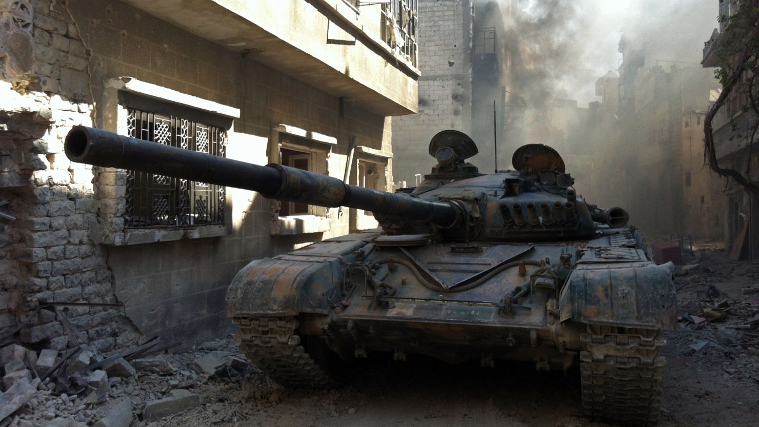 A government forces tank is seen in the Khalidiyah neighbourhood of Syria's central city of Homs on July 28, 2013. 