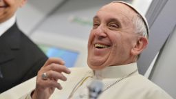 Pope Francis smiles during a long press conference aboard the flight to Italy from Rio de Janeiro on July 28.,