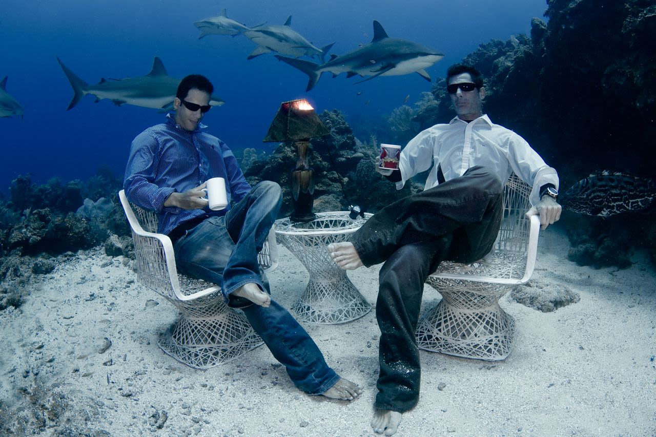 See those sharks swimming in the backgroud? Yep, they're real. The casually dressed men sipping coffee underwater? Real too. Welcome to the remarkable real life water world.