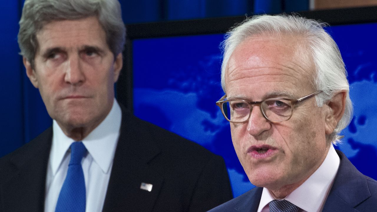 John Kerry is pictured on Monday after announcing former US ambassador to Israel, Martin Indyk (R), will head the peace talks.