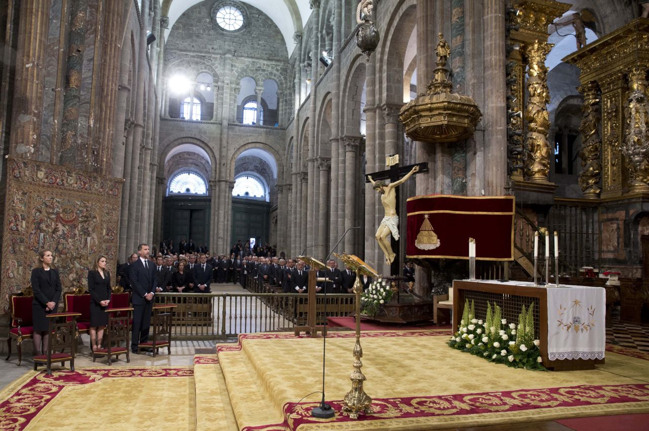 Spain's Princess Elena, left, Princess Letizia and Prince Felipe attend <a href="http://www.cnn.com/2013/07/29/world/europe/spain-train-crash/index.html">a funeral Mass for the victims of a train</a> derailment at a cathedral in Santiago de Compostela on Monday July 29. At least 79 people have been confirmed dead in the July 24 crash in northwest Spain.