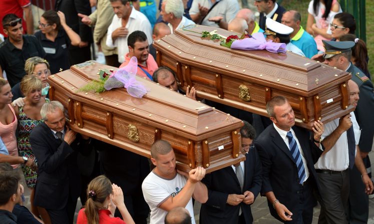 Coffins get carried out of the morgue in Monteforte Irpino on July 29.