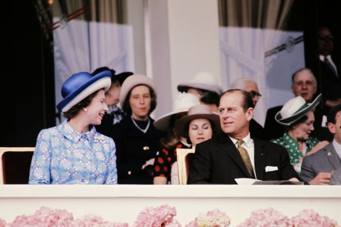 Queen Elizabeth II and her husband the Duke of Edinburgh enjoy the racing at Longchamps in Paris in 1972.   