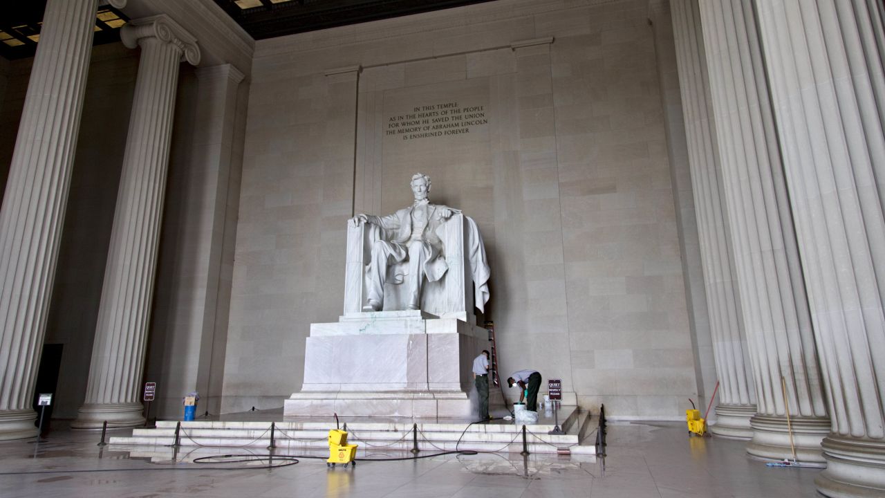 National Park Service workers clean the Lincoln Memorial in Washington on Friday, July 26, after someone splattered green paint on the statue of Abraham Lincoln and on the floor. A woman was arrested Monday, July in connection with vandalism on two locations inside the National Cathedral. Jiamei Tian, 58, was not immediately tied to the vandalism of the Lincoln Memorial or other incidents that occurred over the past week.