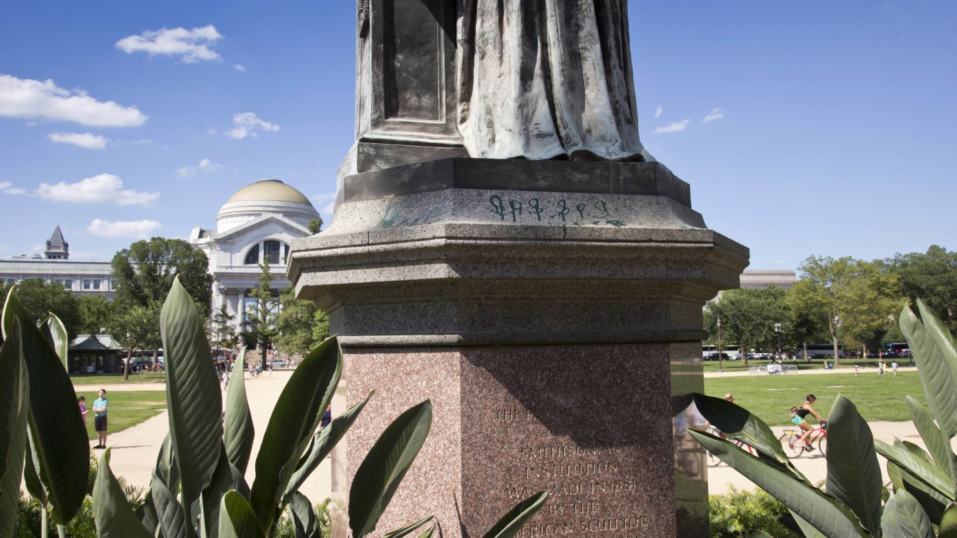 The paint on the statue of the Smithsonian's first secretary was discovered the same day as the Lincoln Memorial vandalism.