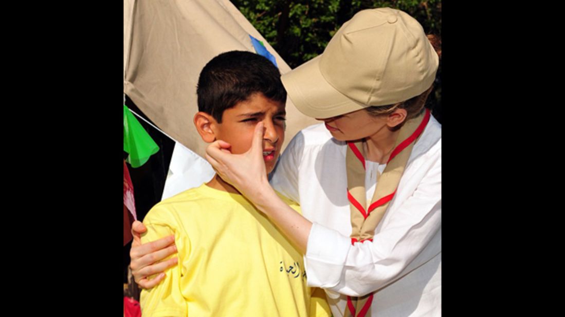 The President's wife, Asma al-Assad, wipes away a tear on a boy's face. The embattled president announced he was adding Instagram to his social media blitz last week via a message posted to his Twitter account. 