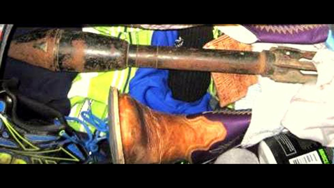 Law enforcement officers evacuated Dallas-Fort Worth's baggage area and the terminals near a bazooka round found in checked luggage. The item was moved to a remote location, where it was deemed inert.