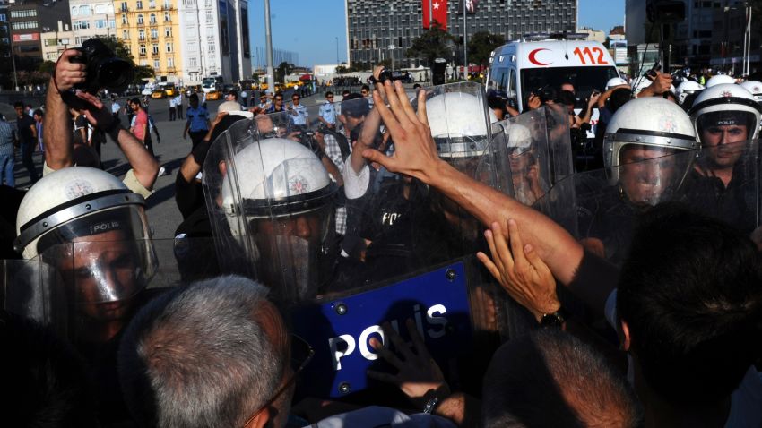 Turkish police attempt to disperse anti-government protestors during a demonstration near the entrance of Taksim Square on July 20, 2013, in Istanbul. Police dispersed on July 20 hundreds of protesters who gathered around Gezi Park, the bastion of anti-government protests that shook Turkey in June, to attend the wedding of two protesters. AFP PHOTO /BULENT KILICBULENT KILIC/AFP/Getty Images