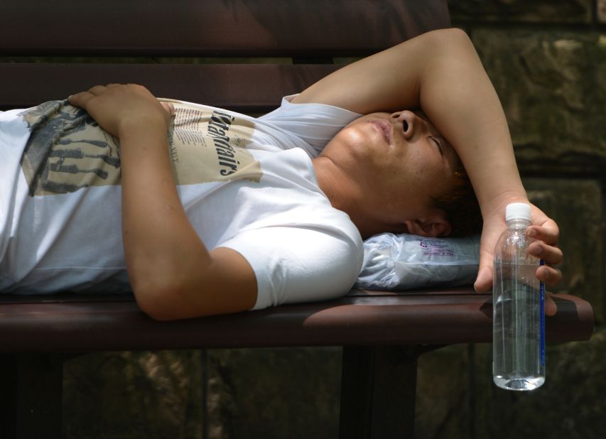A man takes a break from the heat in a Shanghai park on July 2.