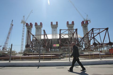 Twenty-seven years after the nuclear disaster, engineers work on April 26, 2013, to construct a colossal arch-shaped structure to permanently cover the exploded reactor.