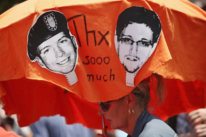 Demonstrators in Berlin hold a protest march on Saturday, July 27, in support of Snowden and WikiLeaks document provider Bradley Manning. <a href="index.php?page=&url=http%3A%2F%2Fwww.cnn.com%2F2013%2F08%2F01%2Fus%2Fsnowden-manning%2Findex.html">Both men have been portrayed as traitors</a> and whistle-blowers. Manning was acquitted on July 30 on the most serious charge of aiding the enemy, but he was convicted on several other counts and likely faces a lengthy term in a military prison.