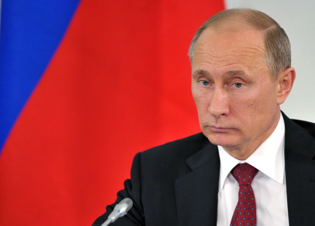 Russian President Vladimir Putin attends a meeting in Prokhorovka on July 12. Russian officials said Snowden abandoned his effort to seek asylum in the country after Putin warned that he would have to stop leaking information about U.S. surveillance programs if he wanted to stay.