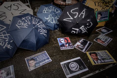 Umbrellas with slogans are lined up before a protest march to the U.S. consulate in Hong Kong on June 15.  Snowden was hiding in Hong Kong, where he arrived on May 20 before blowing the lid off the NSA surveillance operation.