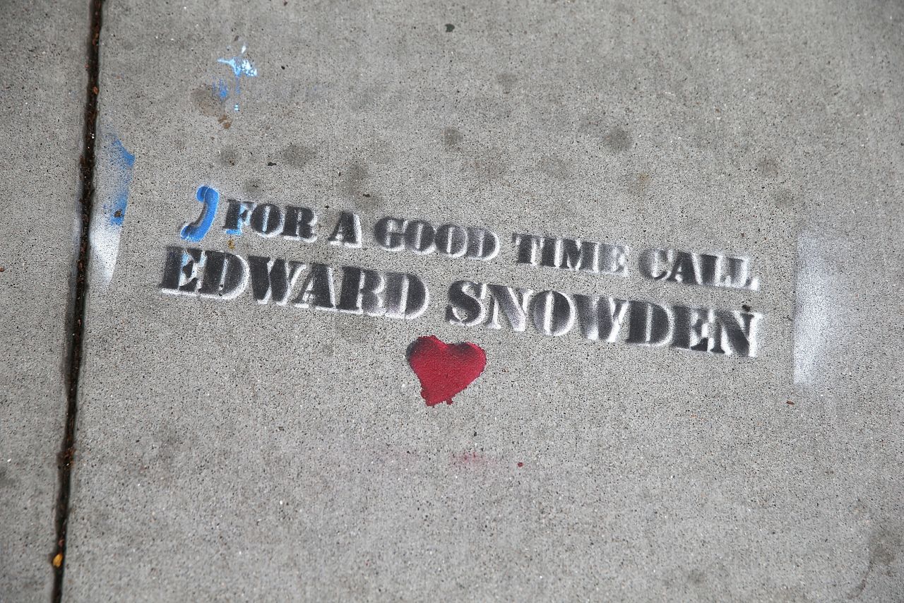 Graffiti sympathetic to Snowden is stenciled on the sidewalk in San Francisco on June 11.
