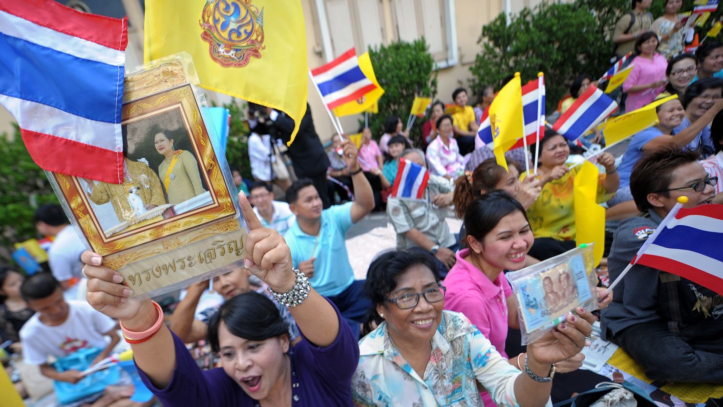 Well-wishers wait for Thailand's King Bhumibol Adulyadej outside Siriraj hospital in Bangkok on Thursday.