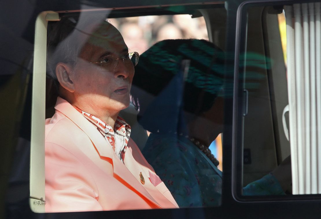Thai King Bhumibol Adulyadej (L) and Queen Sirikit (R) are pictured in a vehicle after leaving Bangkok's Siriraj hospital.