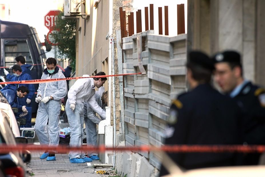 A bomb squad team collects evidence at a construction site where a rocket was launched near the <a href="http://www.time.com/time/world/article/0,8599,1577262,00.html#ixzz1XpywafjU" target="_blank" target="_blank">U.S. Embassy in Athens, Greece,</a> on January 12, 2007. The anti-tank missile tore through the embassy, but there were no injuries.