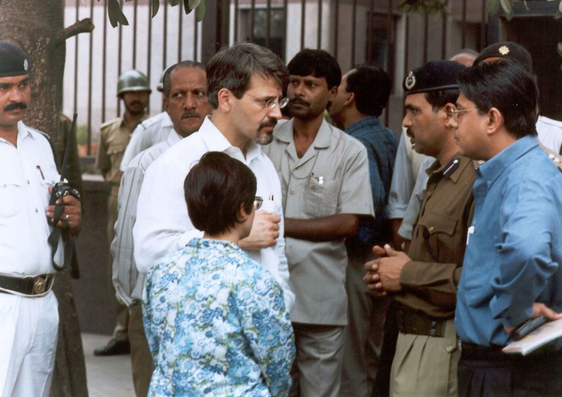 Christopher Sandrolini, the U.S. consul general in Calcutta, speaks with Indian officials outside the <a href="http://news.bbc.co.uk/2/hi/south_asia/1774483.stm" target="_blank" target="_blank">U.S. government information center in Calcutta</a>, near the U.S. Consulate, where heavily armed gunmen killed five Indian police officers on January 22, 2002.