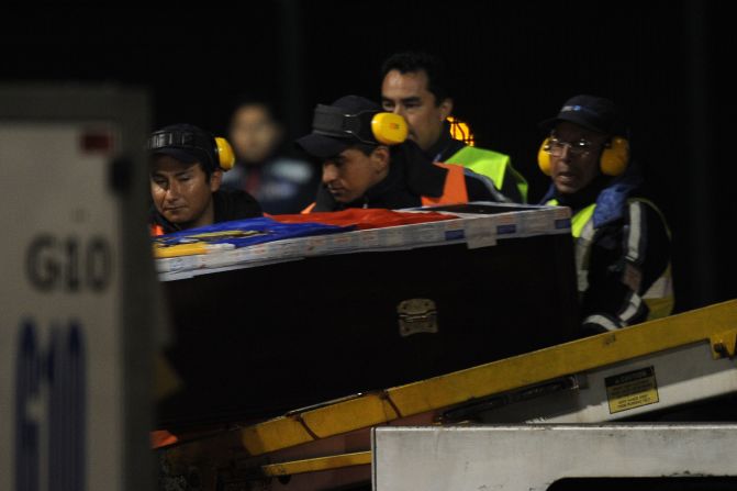 The coffin of Ecuador international Christian Benitez arrives at Mariscal Sucre airport in Quito.  