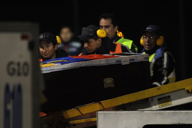 The coffin of Ecuador international Christian Benitez arrives at Mariscal Sucre airport in Quito.