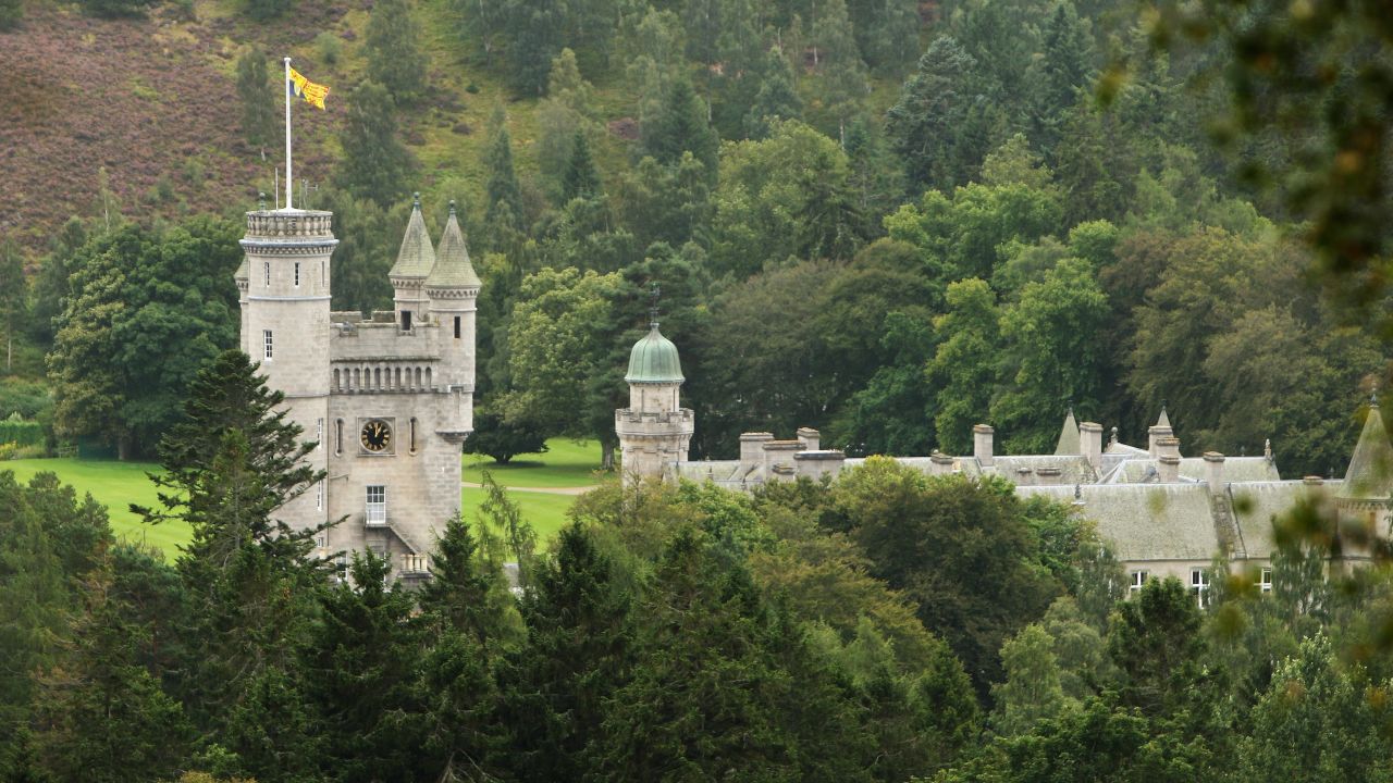 File photograph of the Royal Standard flying from the turrets of Balmoral Castle in Scotland. 