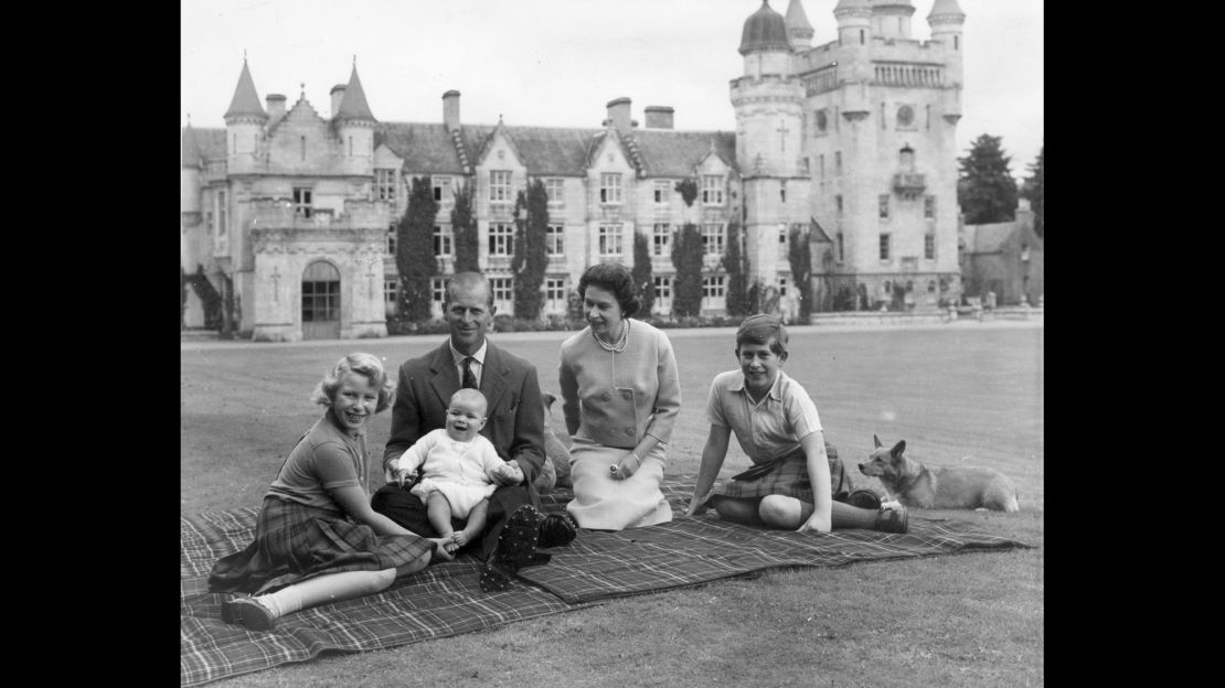 In this September 1960 photo, the Queen and Prince Philip pose on the lawn at Balmoral with their children, Prince Andrew, center, Princess Anne, left, and Prince Charles.