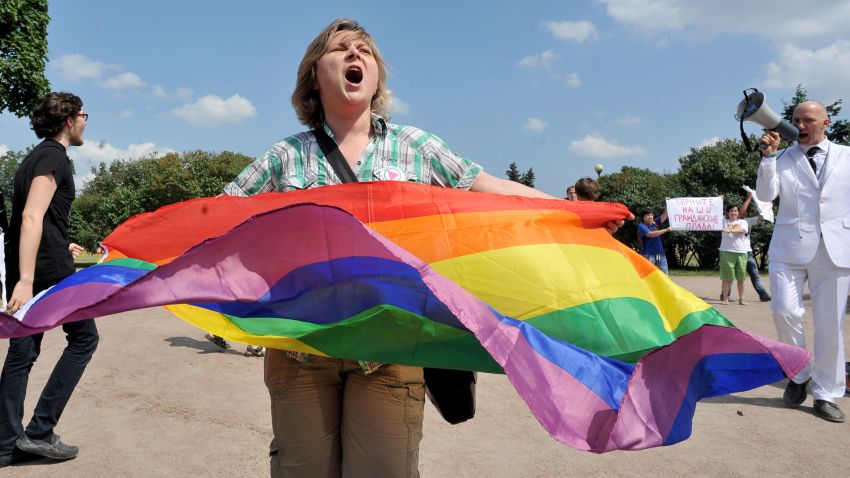 A gay rights activist holds a rainbow flag as she takes part in a gay pride event in Saint Petersburg on June 29, 2013. Russian police arrested dozens of people on June 29 after clashes erupted in the city of Saint Petersburg between pro- and anti-gay demonstrators. AFP PHOTO / OLGA MALTSEVA (Photo credit should read OLGA MALTSEVA/AFP/Getty Images)