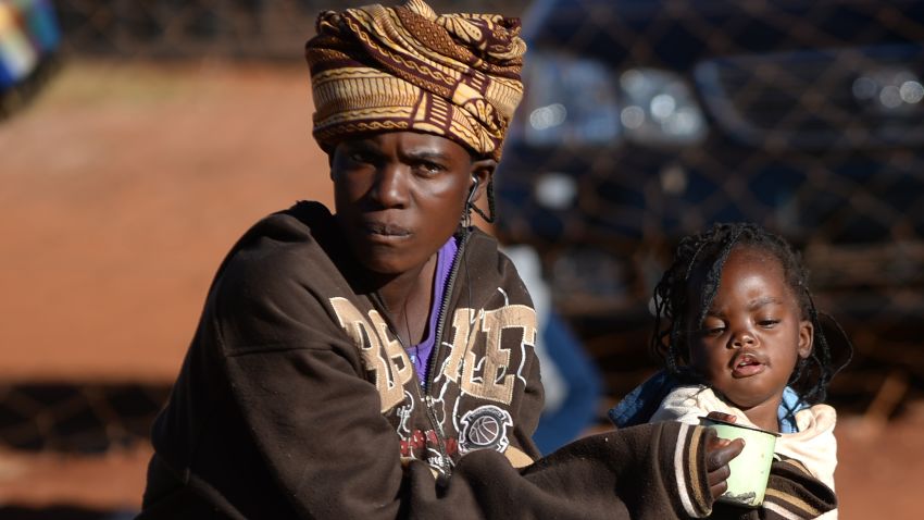A vendor sits at a market in Domboshava, 60km north of Harare, on August 1, 2013.
