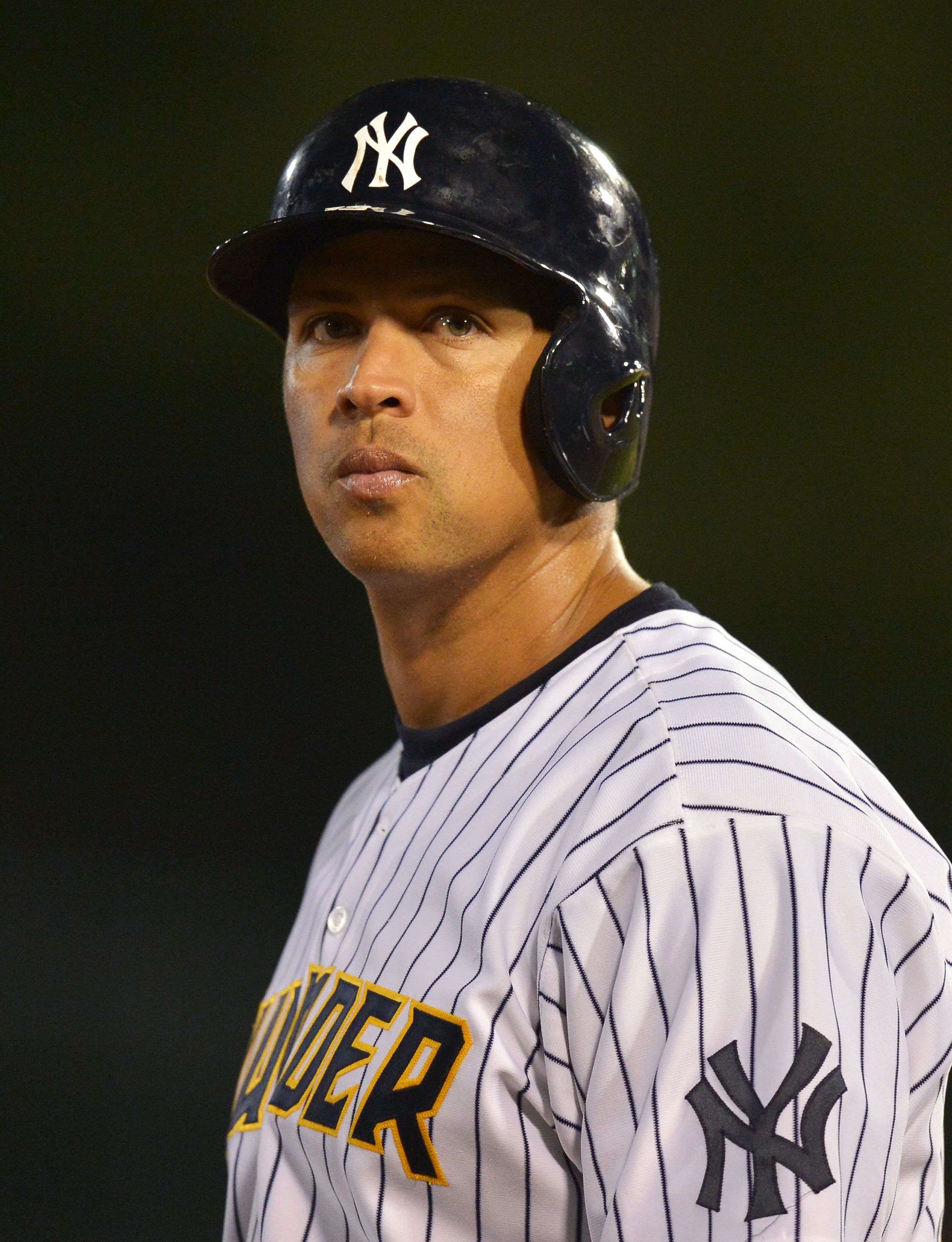 New York Yankees Alex Rodriguez reacts holding the MLB World