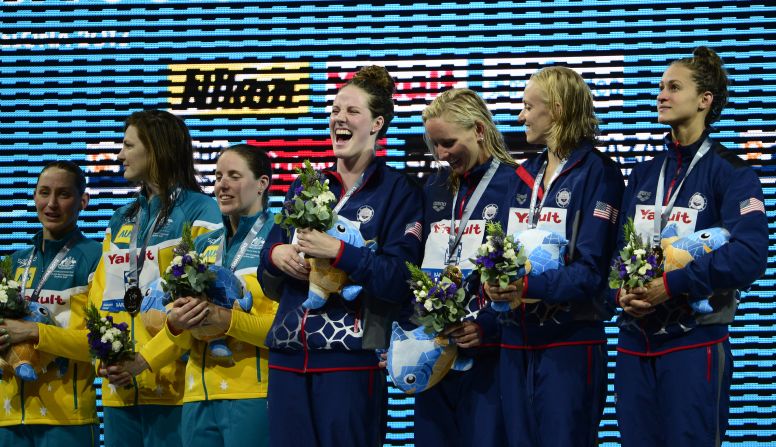 Missy Franklin, left, enjoys her spot at the top of the medal rostrum after winning gold as part of the U.S. women's 4 x 100 meter medley relay team at the world swimming championships in Barcelona. It was her sixth victory of the meet, setting a new record total for a female swimmer.