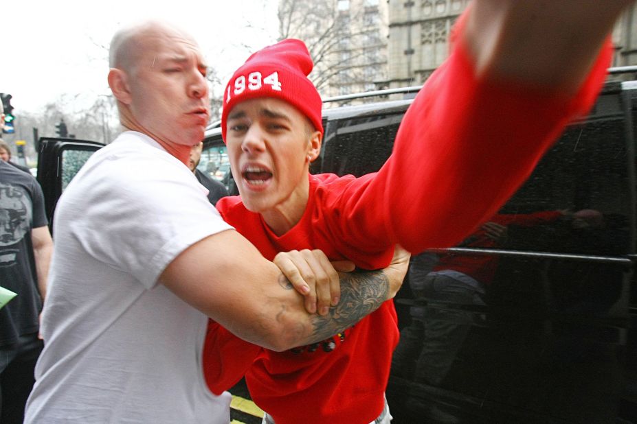 Bieber and photographers, we've learned by now, don't mix. As he exited the hospital at the end of his turbulent week, the singer got into a shouting match with a paparazzo in London, <a href="http://www.cnn.com/2013/03/08/showbiz/justin-bieber-hospital/index.html" target="_blank">telling the photographer that he'd "f*** him up."</a>