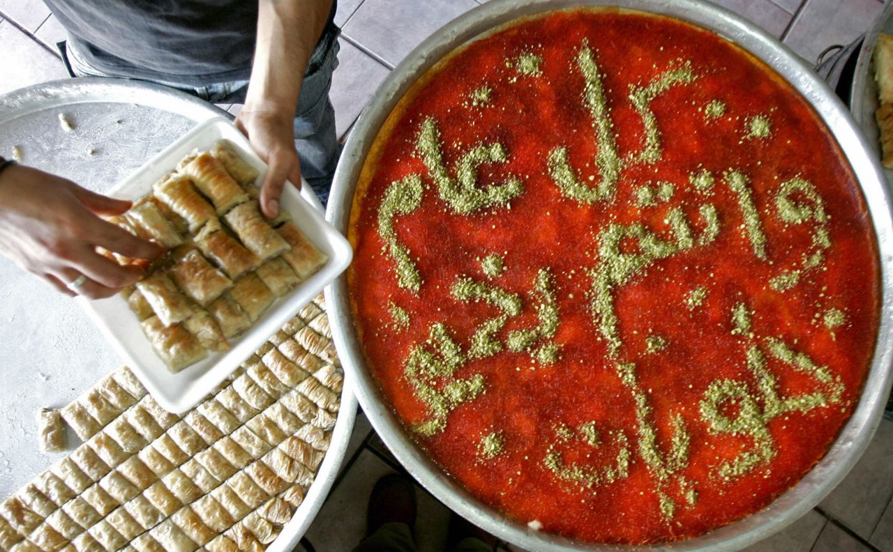 A Palestinian baker prepares baklava -- a rich, sweet treat made of layers of phyllo pastry filled with chopped nuts and sweetened with syrup or honey -- in the West Bank city of Jenin. 