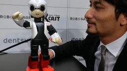 Japan's Tokyo University robot creator Tomotaka Takahashi demonstrates a humanoid robot Kirobo which reacts to Takahashi's voice and speaks with gestures in Tokyo on June 26, 2013. 