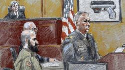 This courtroom sketch shows military prosecutor Lt. Col. Steve Henricks, right, speaking as Nidal Malik Hasan, center, and presiding judge Col. Tara Osborn look on, during the court-martial on Tuesday, August 6. 