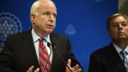 US Republican Senators John McCain (L) and Lindsey Graham (R) address a news conference on August 6, 2013 in Cairo, Egypt. 