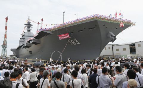 A launching ceremony for Japan's largest military ship since World War II is held in Yokohama in August 2013.                                                                                                                                                                                                                                                                                                                                                                                                                                                                                                                            
