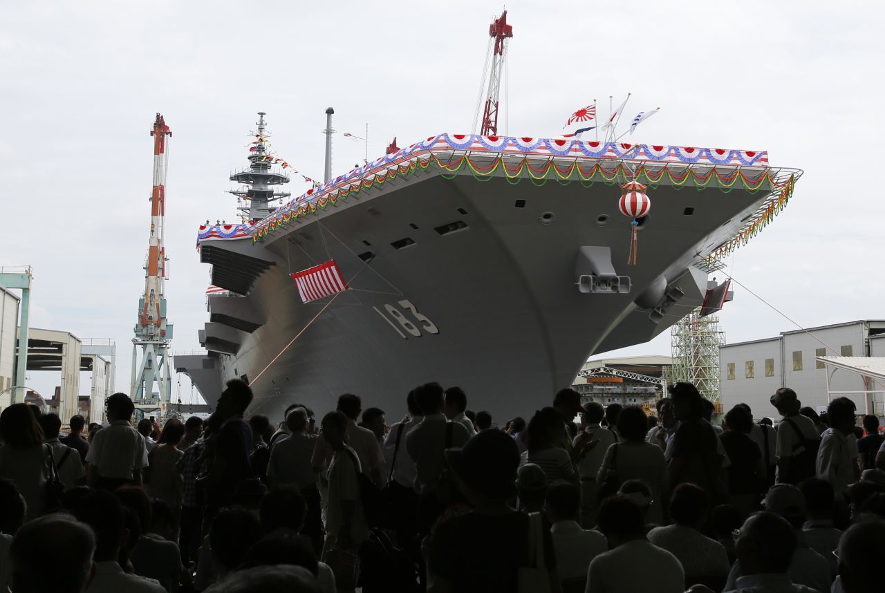 Crowds gather around the Izumo in Yokohama during the launching ceremony.