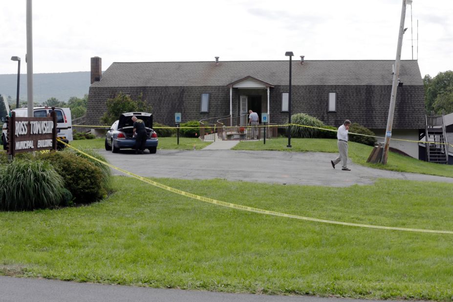 Investigators work the crime scene at the Ross Township Municipal Building on August 6, in Saylorsburg, Pennsylvania.