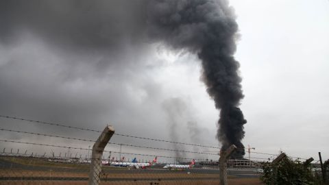 Heavy smoke rises from the airport's main building on August 7. 