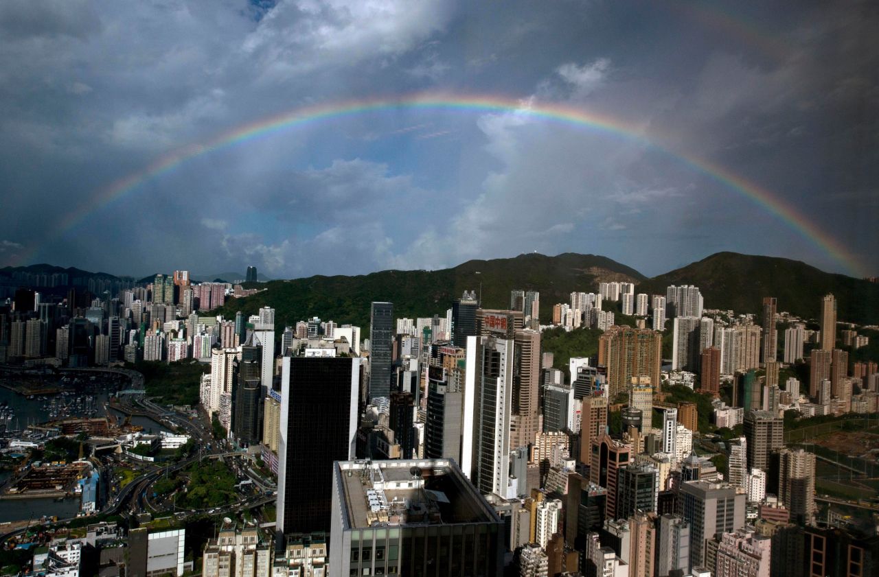 A rainbow appears in the skies above a Hong Kong office building on Wednesday, August 7. Click through to see other images of weather around the world.