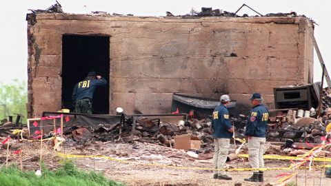 FBI agents investigate a bunker that survived the blaze that leveled the rest of the compound on April 23, 1993.