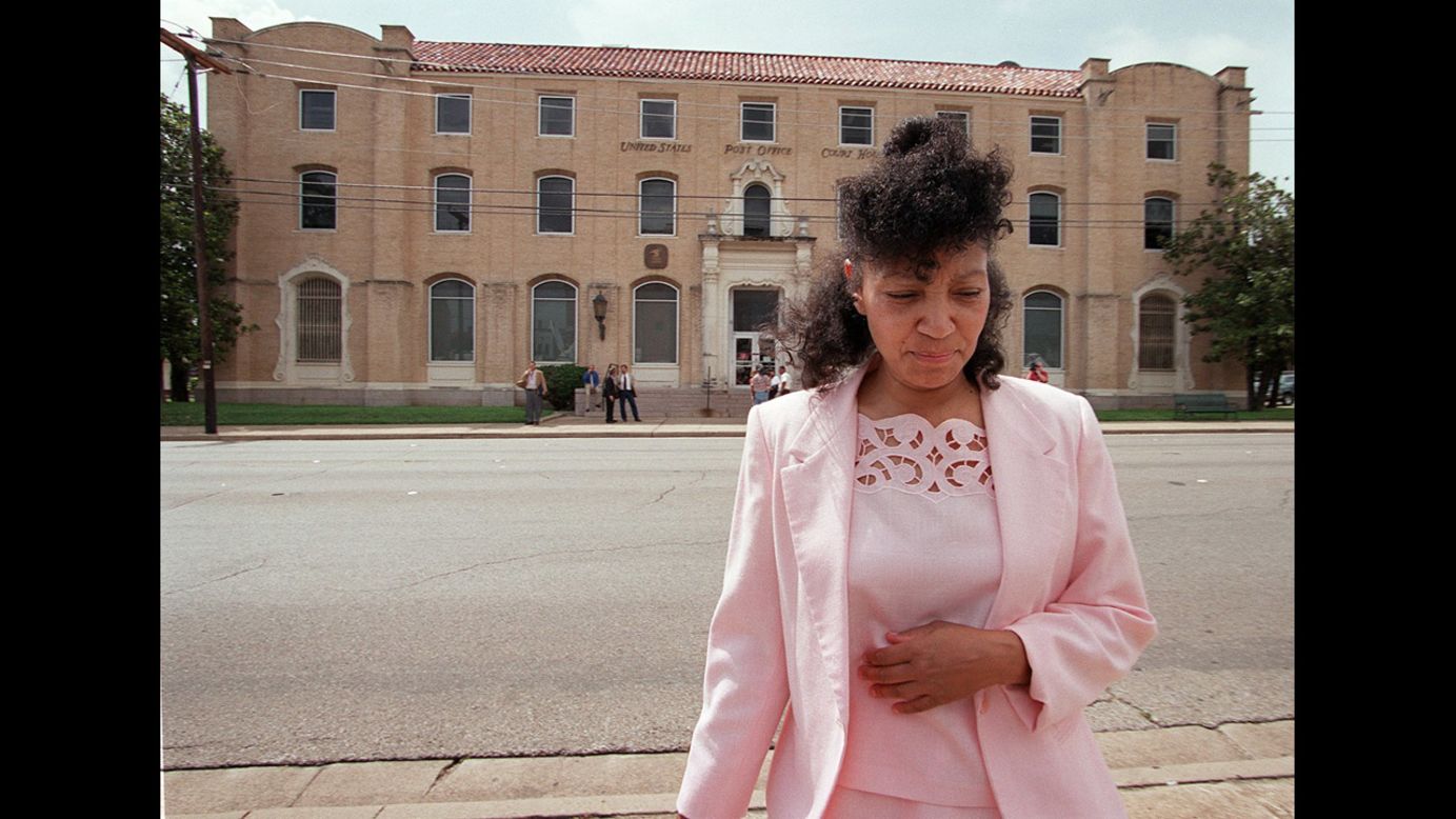 Fire survivor and Branch Davidian Sheila Martin walks away from a federal courthouse in Waco on June 19, 2000, during a break in the proceedings for a lawsuit filed against the government by survivors and family members of victims.