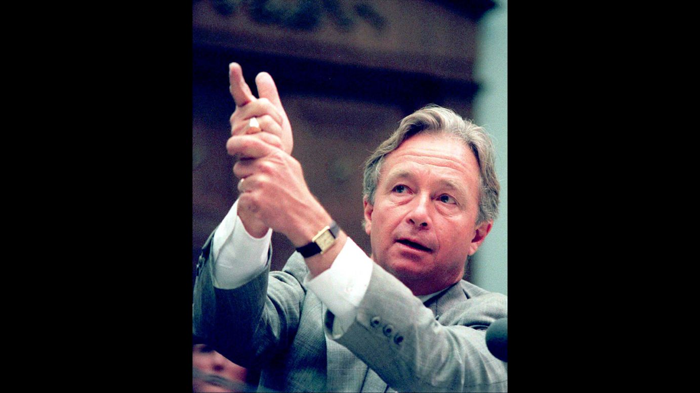 Richard DeGuerin, lawyer for the late Koresh gestures as if firing a gun during his testimony before the Congressional panel inquiry into the incident in Texas on July 25, 1995.