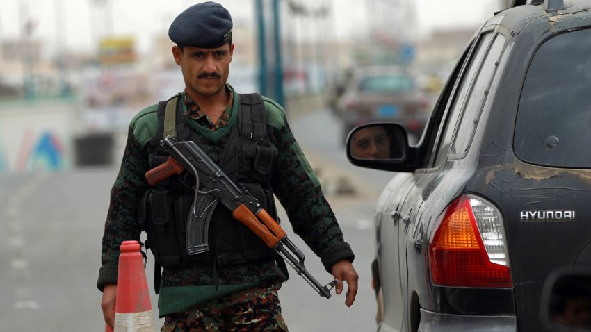 A Yemeni soldier checks vehicles near Sanaa International Airport on August 6, 2013 in Yemen. 