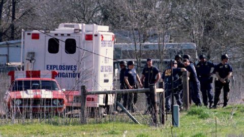 ATF agents gather near a bomb truck on March 8, 1993, as they search a building for arms near the compound.