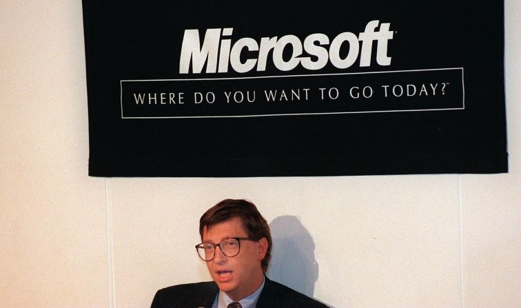 Founder Bill Gates with the Microsoft logo that was created in 1987 and is still used on some of the company's products.