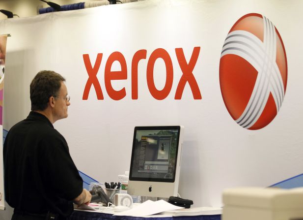 The current Xerox logo is displayed at the Macworld iWorld 2012 conference. Xerox is well known for photocopiers and printers. It also handles digital production printing.