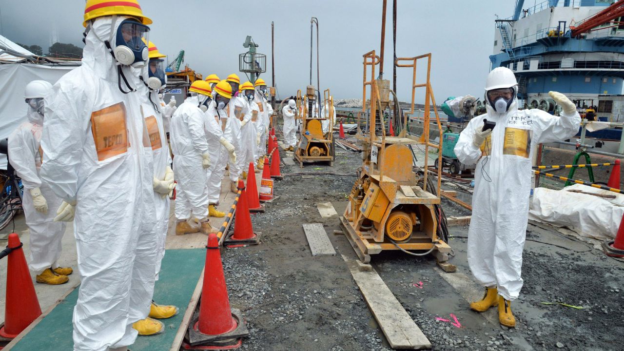 Local government officials and nuclear experts inspect a construction site at Fukushima Dai-ichi nuclear plant.