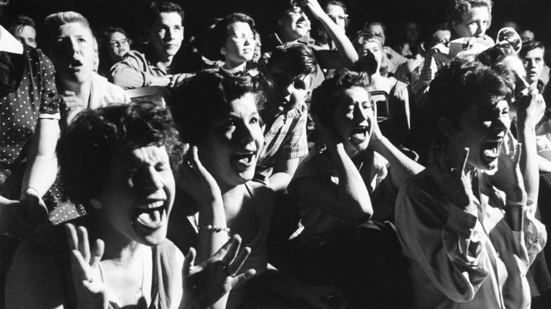 Screaming teenage girls watching Elvis in concert.